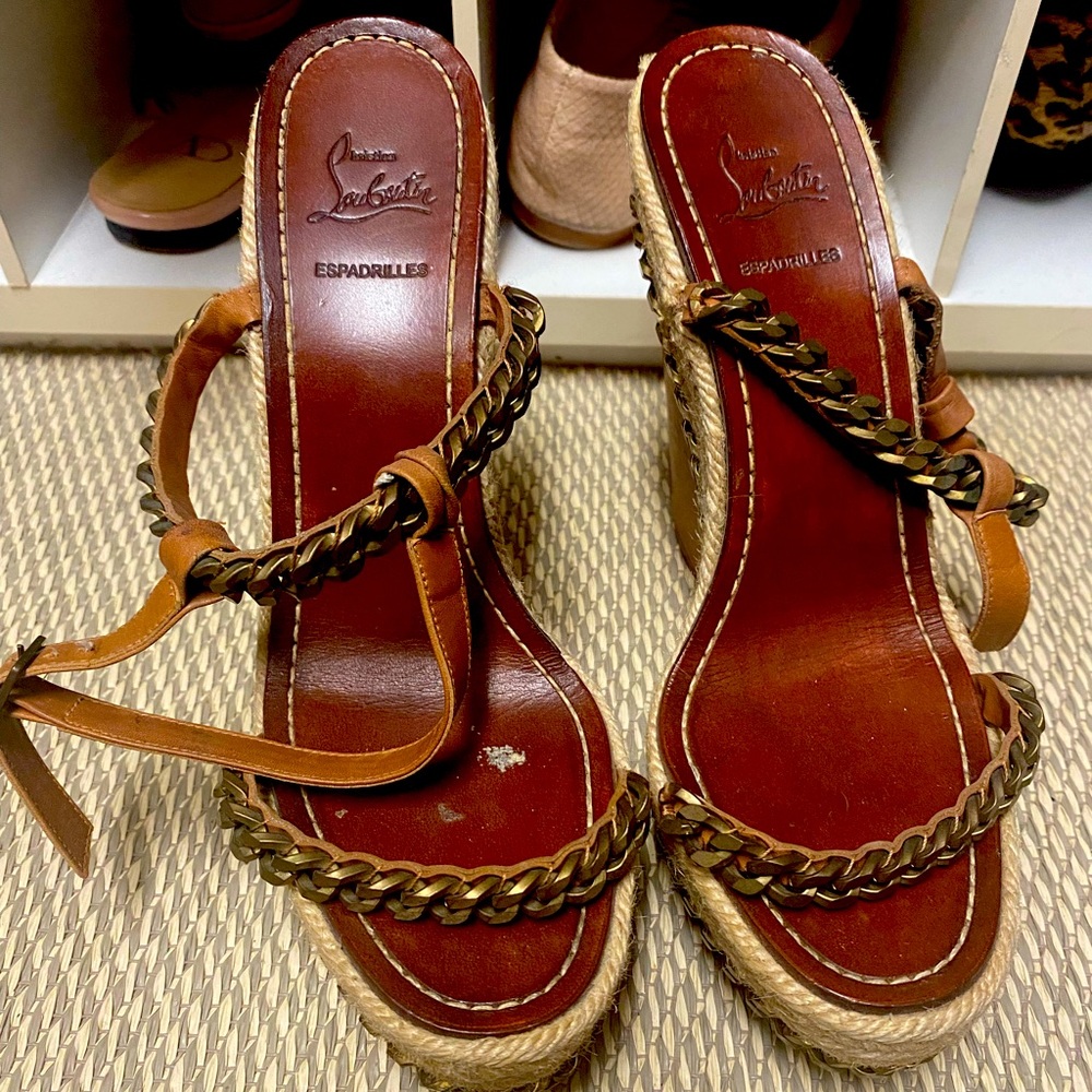 Christian louboutin espadrille wedges with gold chain detail.